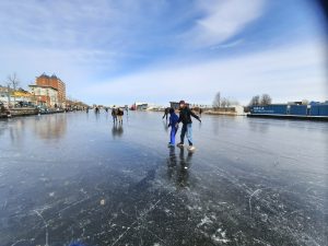 Children playing on a frozen river