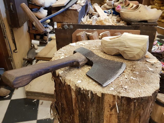 A wooden shoe and an axe